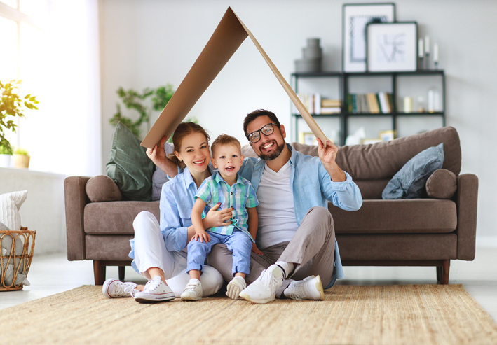 happy-family-mother-father-and-child-son-with-roof-at-home image